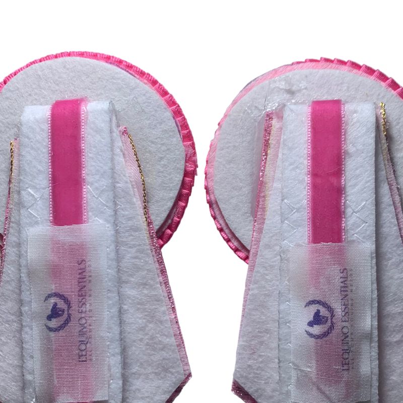 Back image of pink removable rosettes with a brand logo on a white background