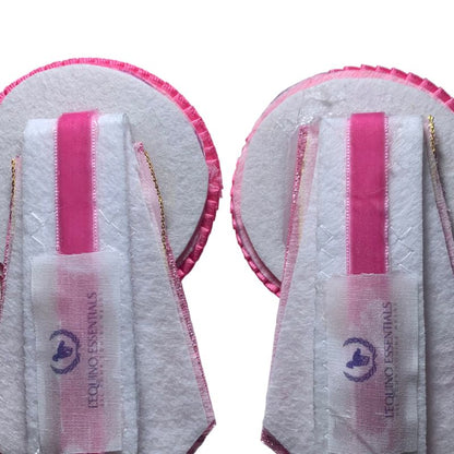 Back image of pink removable rosettes with a brand logo on a white background