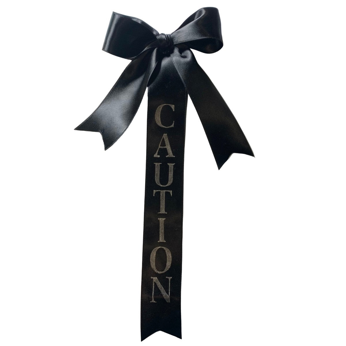 Black ribbon tail-bows with 'CAUTION' text on a white background made by L'Equino Essentials