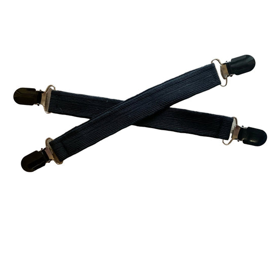 Two black jodhpur clips with black clips on a white background