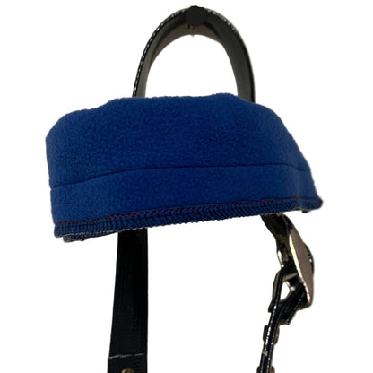 Blue browband cover on a black bridle with a white background