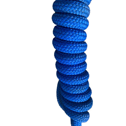 Coiled blue training lead rope on a white background