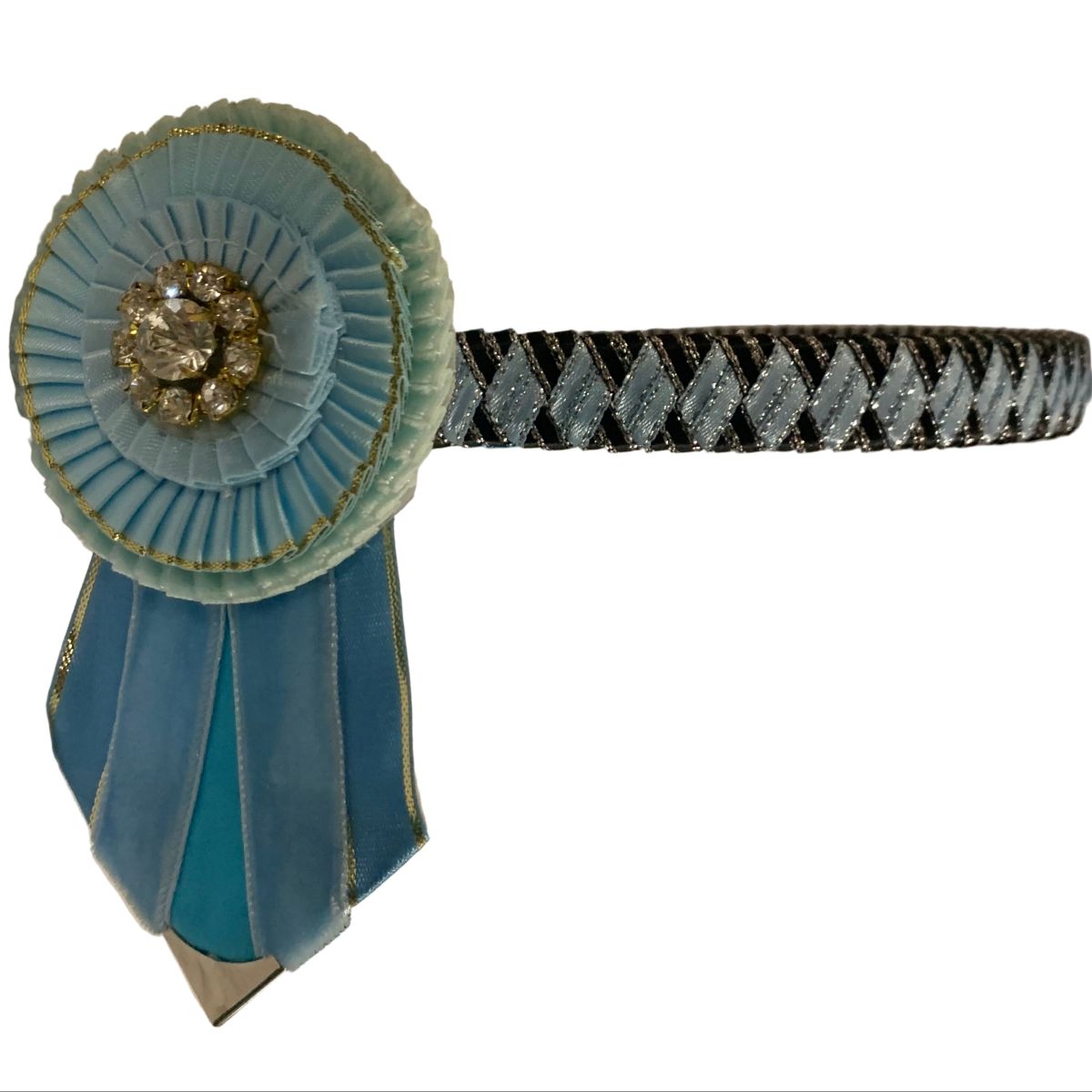 Decorative limited edition show browband with blue ribbon and gold embellishments on a white background