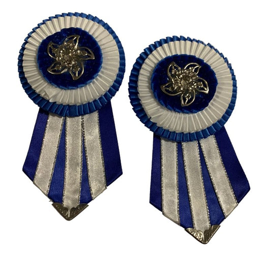 Pair of blue and white removable rosettes with decorative elements on a white background made by L'Equino Essentials