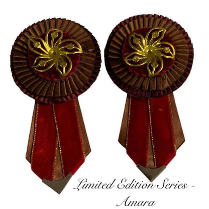 Two decorative removable rosettes with gold center and red and brown tail on a white background, labeled 'Limited Edition Series Amara'.