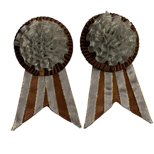 Two decorative removable rosettes with brown and silver design on a white background