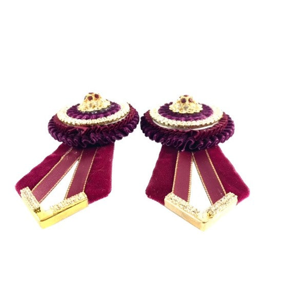 Burgundy luminara removable rosettes on a white background