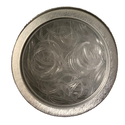 Clear plaiting bands in a metal container on a white background