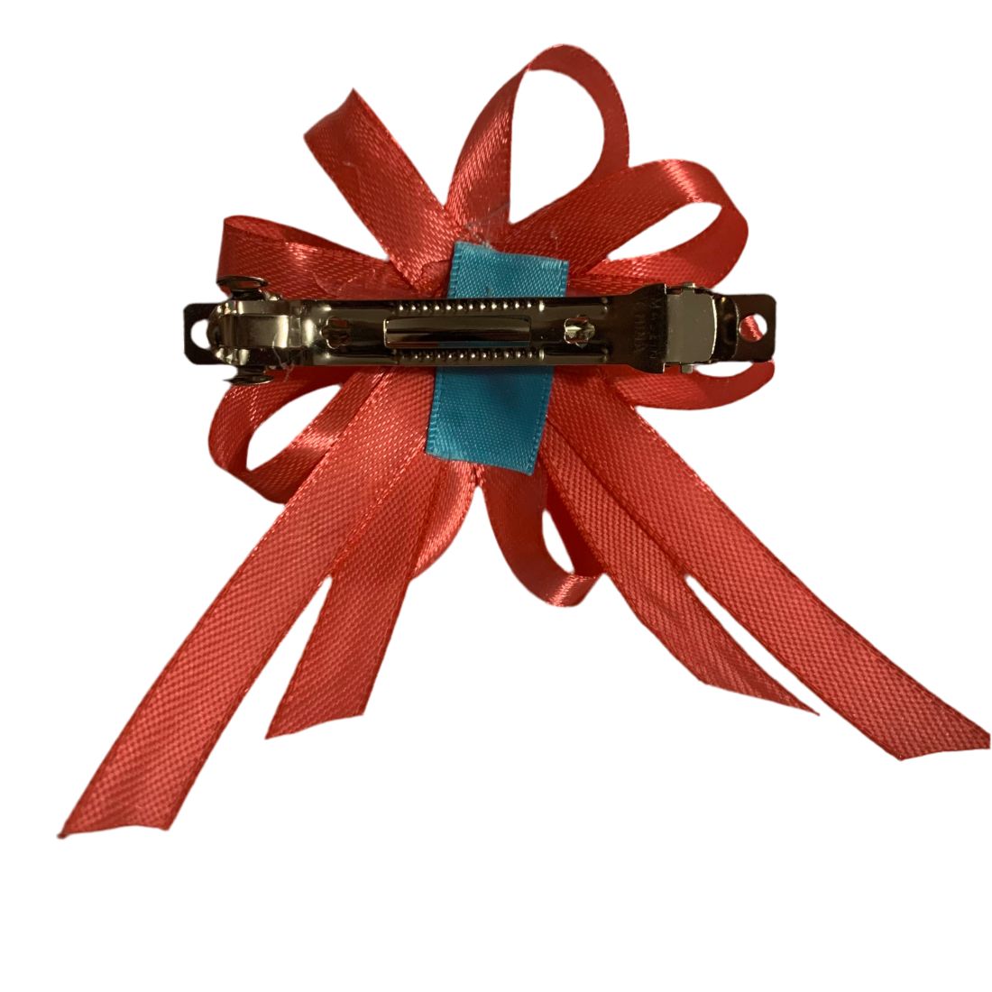 Pink hair bow clip on a white background