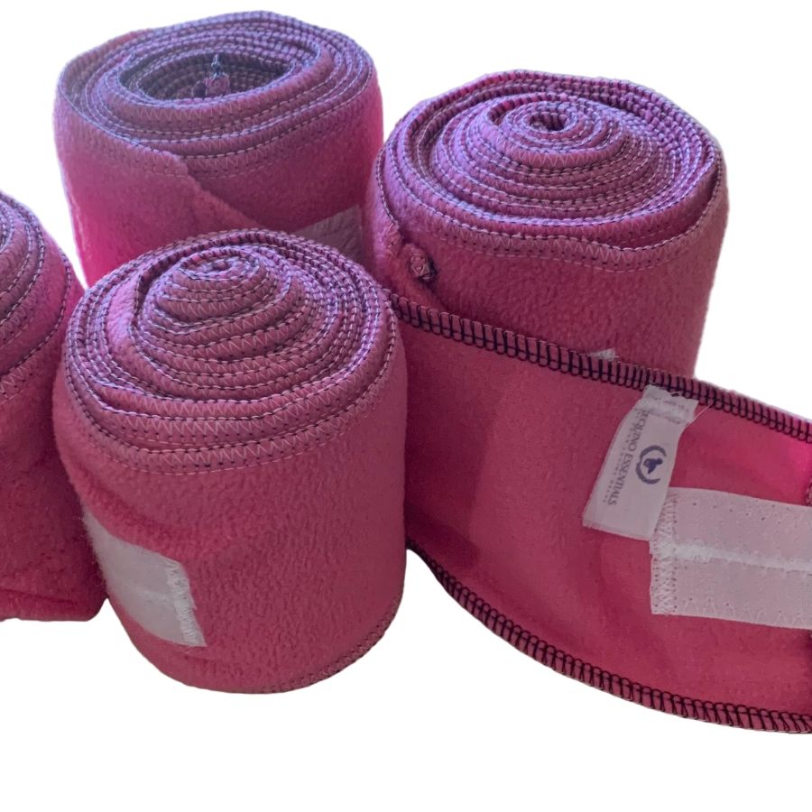 Pink polo wraps with a visible brand label on a white background