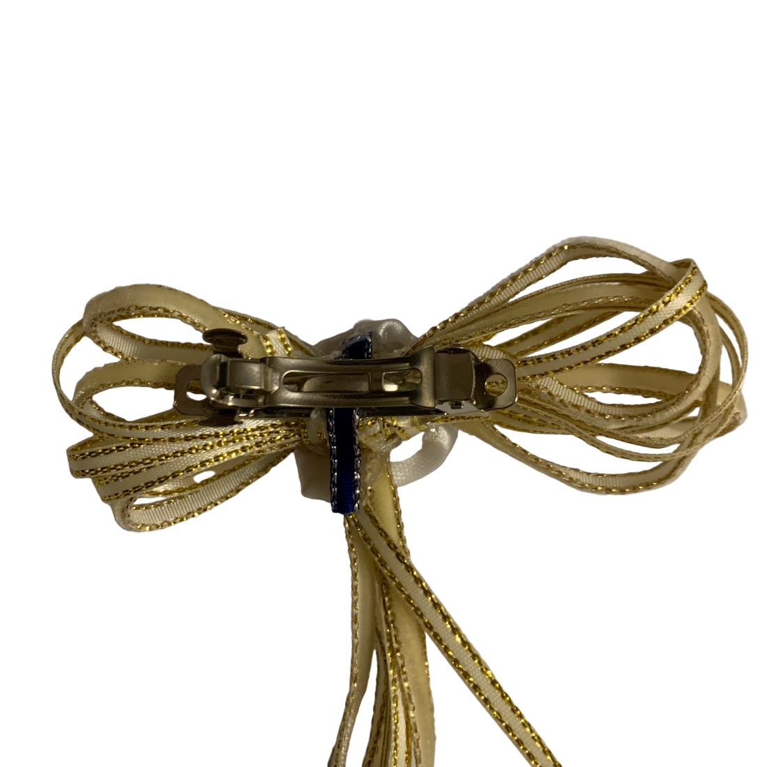 Gold bow with ribbons on a white background make by L'Equino Essentials