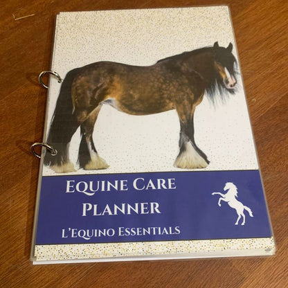 Equine Care Planner by L'Equino Essentials on a wooden surface