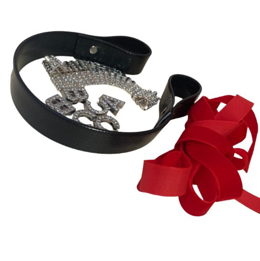 A black PVC browband with a crystal chain and red velvet ribbons, along with additional crystal letters.
