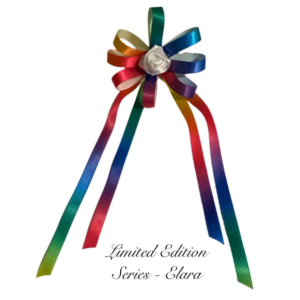 Rainbow hair bow on a white background