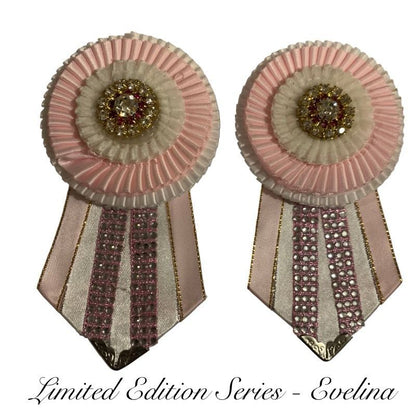 Pink and white removable rosettes made by L'Equino Essentials on a white background
