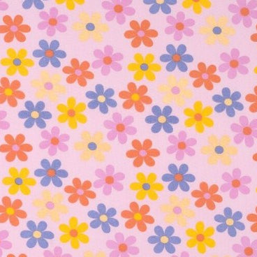 Pattern of colorful flowers on a pink background
