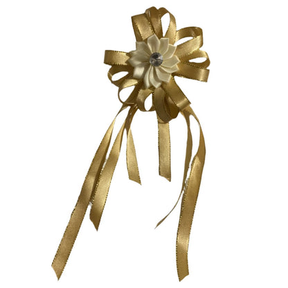Gold decorative bow with ribbons on a white background