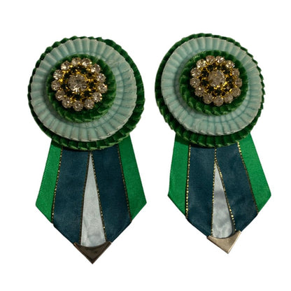 Removable rosettes - seconds in green and light blue on a white background