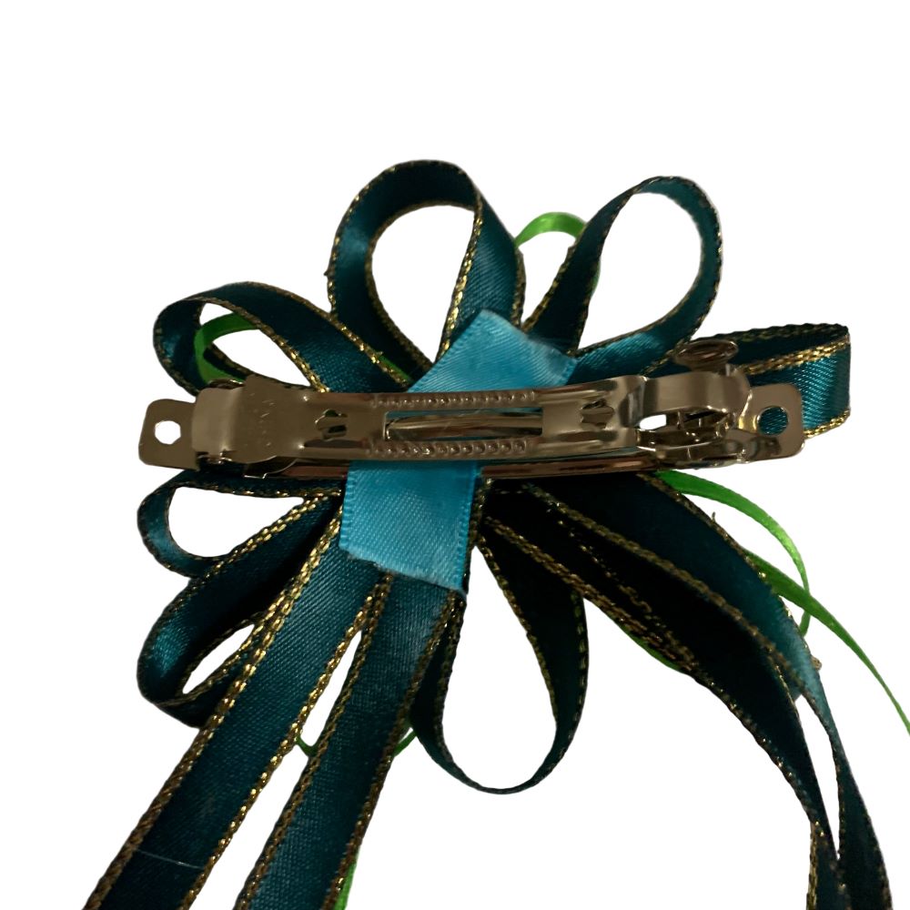 Green equestrian hair bow on a white background made by L'Equino Essentials