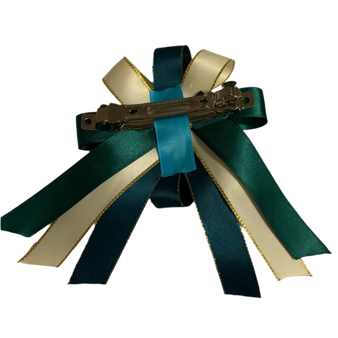 Hair bow with green and beige ribbons and a hair clip on a white background