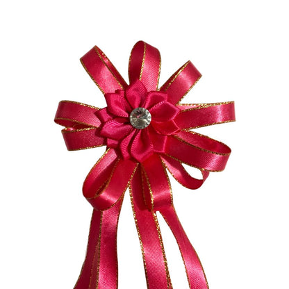 Pink satin hair bow with a crystal center on a white background made by L'Equino Essentials