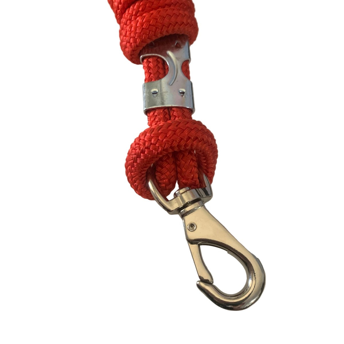 Red horse lead rope with metal clip on a white background