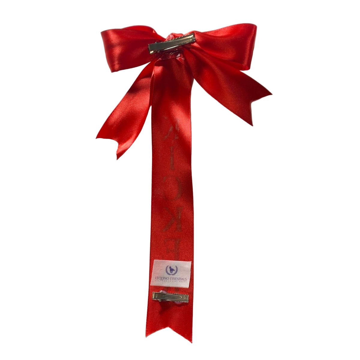 Red satin tail bow with a metal clip on a white background