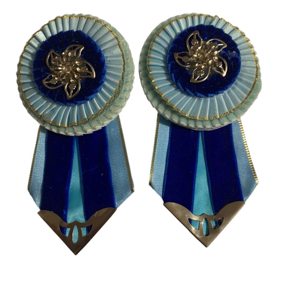 Light blue removable rosettes with royal blue accents on a white background