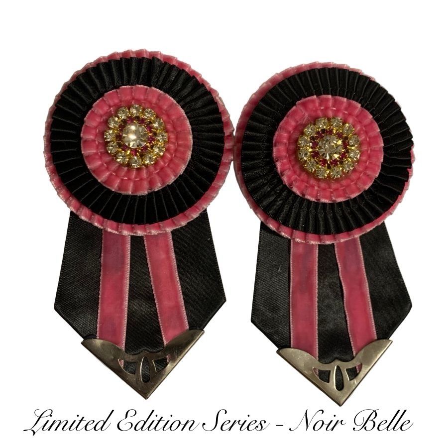 Two decorative removable rosettes with pink center and black outer rim on a white background, labeled 'Limited Edition Series - Noir Belle'.