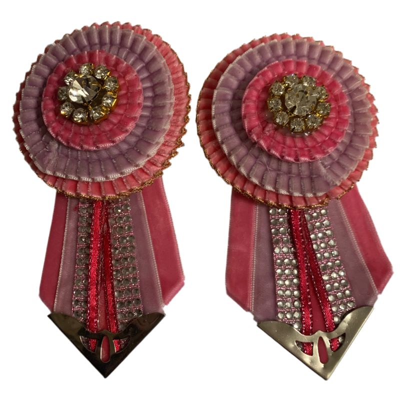 Pink and purple removable rosette seconds on a white background