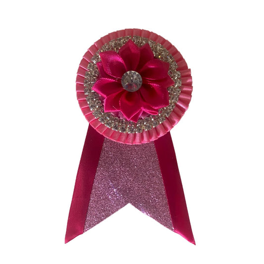 Pink removable rosette with faux leather and flower centre on a white background made by L'Equino Essentials