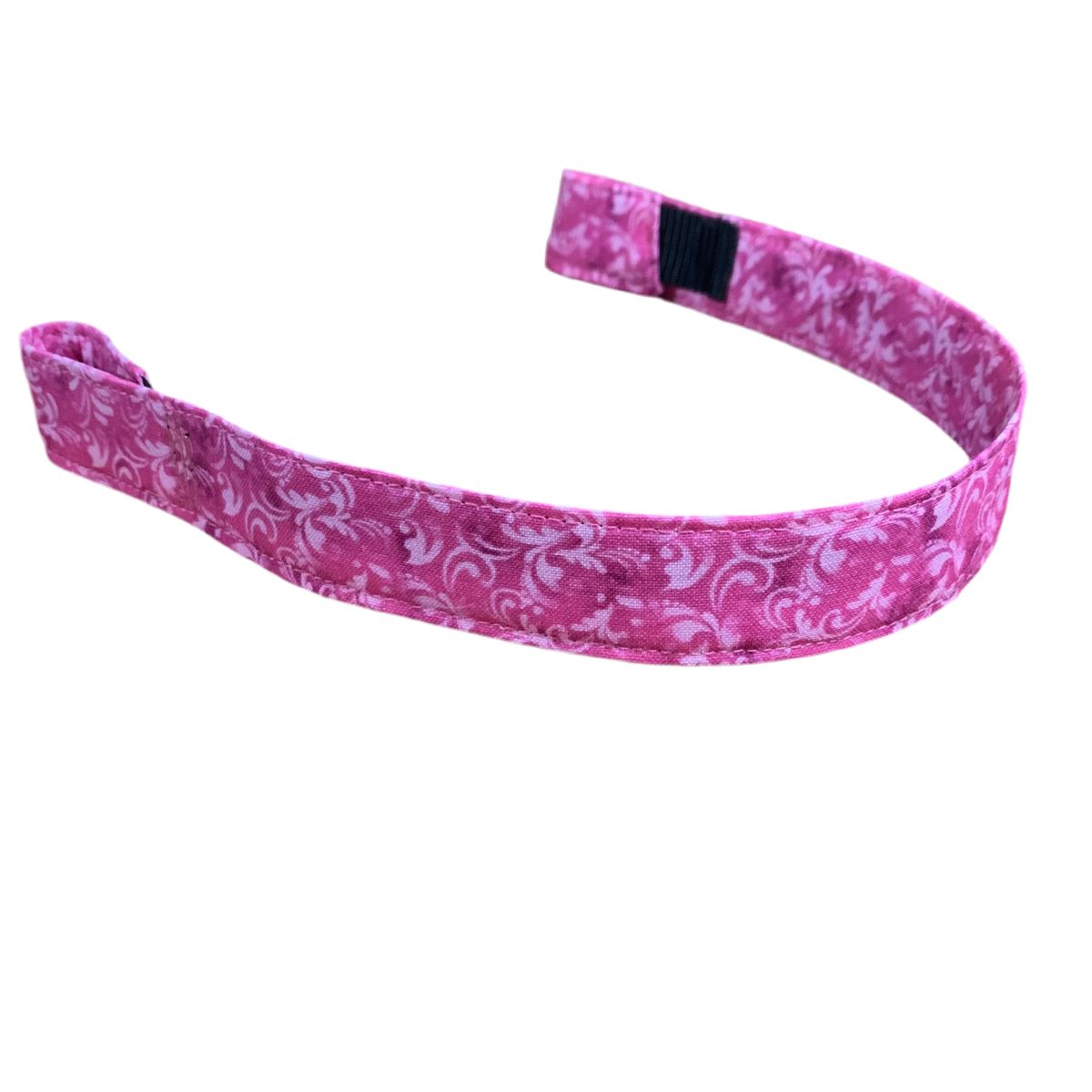Pink browband with white floral pattern on a white background