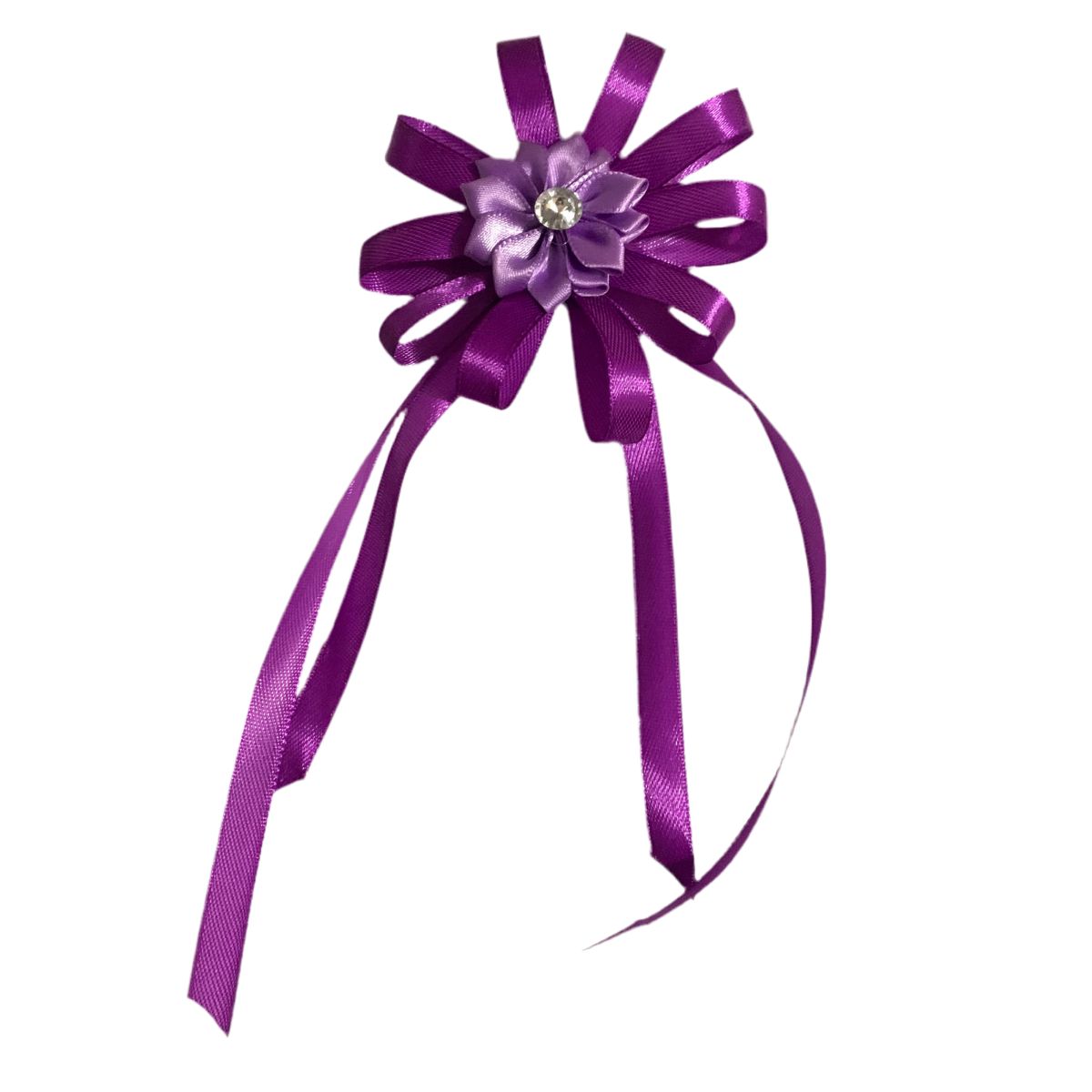 Purple flower hair bow on a white background