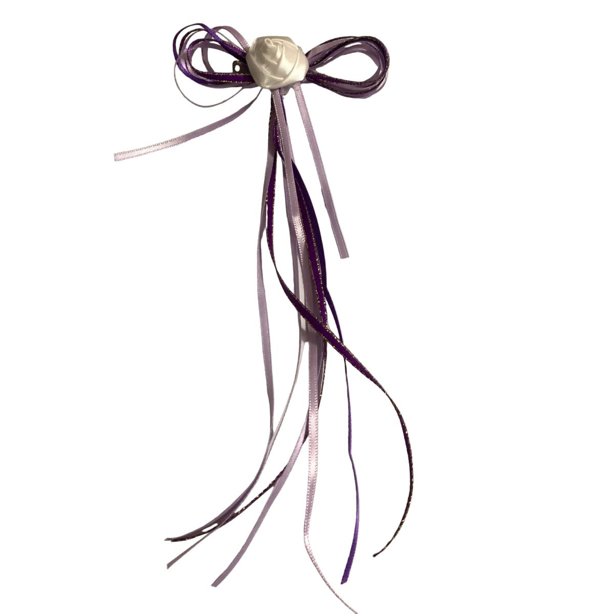 Purple hair bow with ribbons on a white background