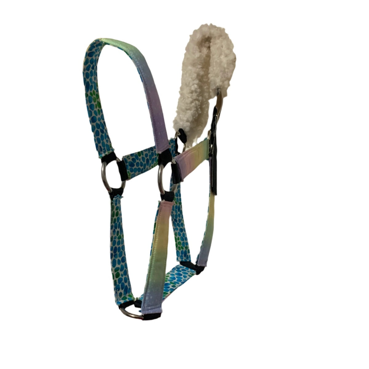 Horse halter with a patterned strap and a fleece lining on a white background