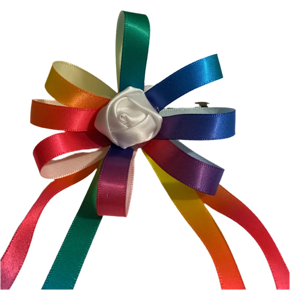 Colorful ribbon equestrian hair bow with a white rose in the center on a white background