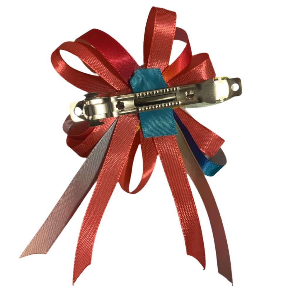 Hair clip with pink ribbon on a white background