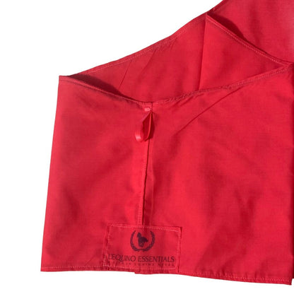 Red cotton horse bib with L'Equino Essentials brand label on a white background