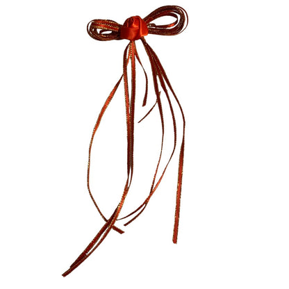 Red long tail hair bow made by L'Equino Essentials on a white background