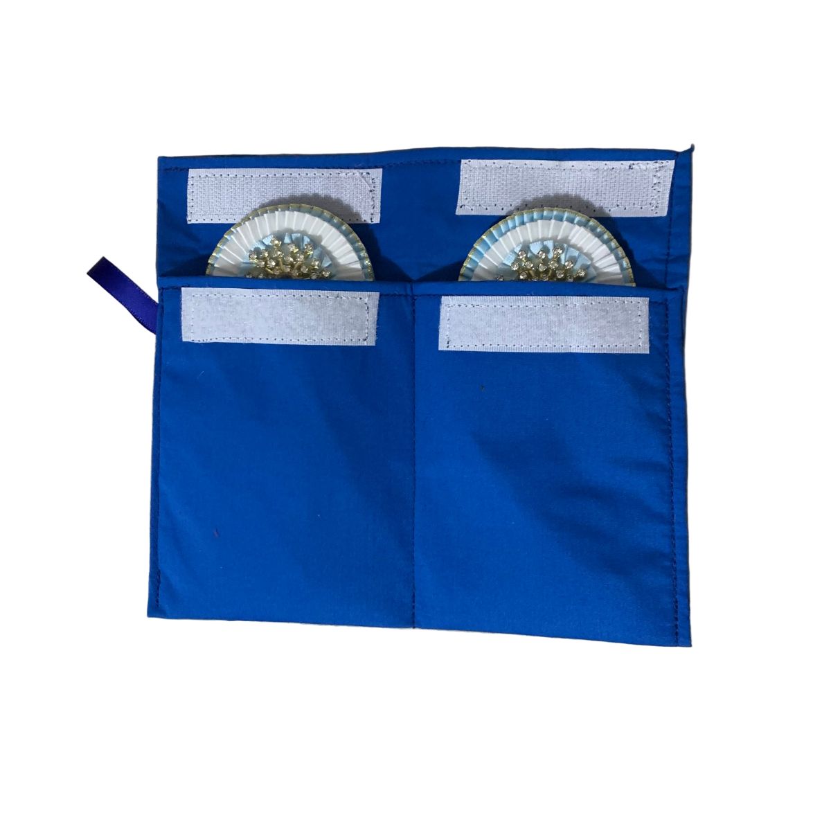 Blue removable rosette storage cover with two compartments, each containing a rosette on a white background