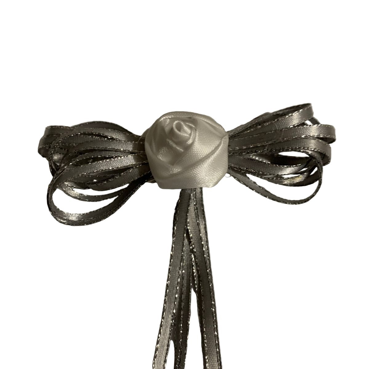 Decorative bow with a rose center on a white background