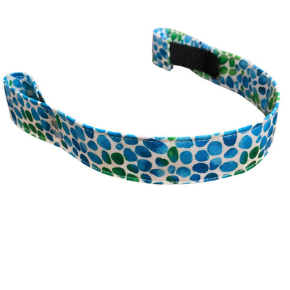 Patterned cotton browband with blue and green dots on a white background