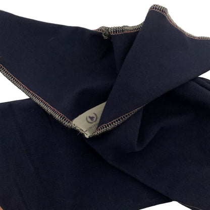 Navy blue tail bag with a brand label on a white background