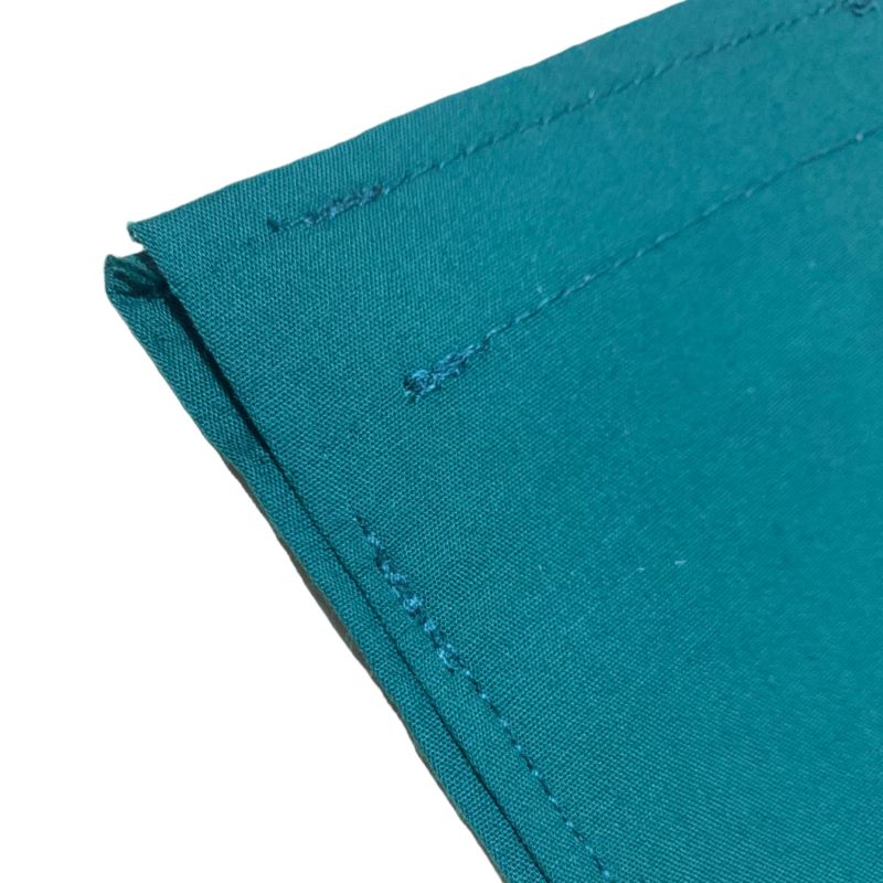 Turquoise browband storage cover on white background