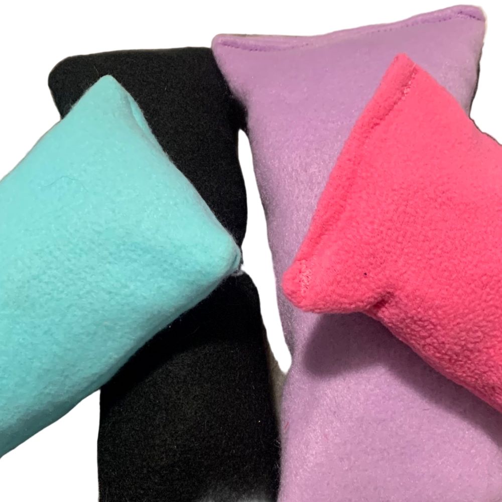 Plush dog chew toys in various colors on a white background