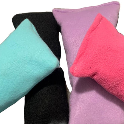 Plush dog chew toys in various colors on a white background